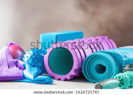 Fitness or yoga items - foam roller, block, mat, balls and roller massager