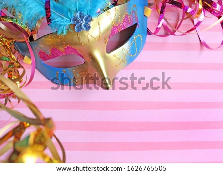 Gold mask with pink background