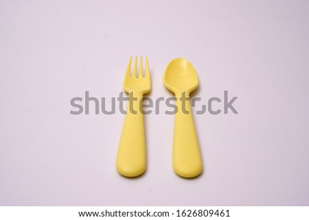 Colorful spoon and fork element on white background