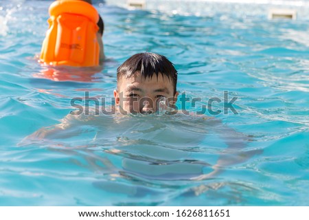 man resting by the pool on a summer day
