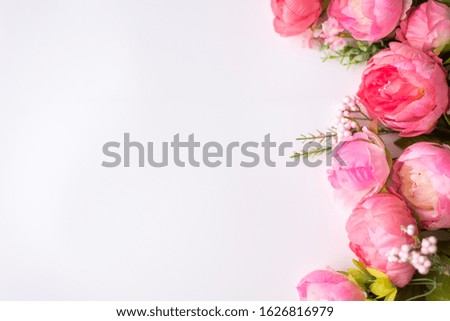Styled stock photo. Feminine floral frame composition. Decorative web banner made of beautiful pink peonies. White background. Empty space. Flat lay, top view. Picture for blog.