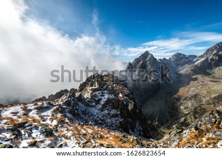 Beautiful Tatras Mountains (Vysoké Tatry, Tatry Wysokie, Magas-Tátra), amazing landscape with mountains in the cloud