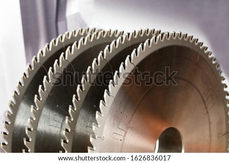 Tool for woodworking, circular saws with carbide brazing for cutting hard wood, close-up, image with copy space. Royalty-Free Stock Photo #1626836017