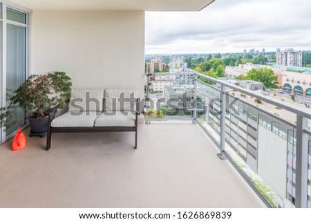 Empty balcony or veranda in a modern house or apartment. Royalty-Free Stock Photo #1626869839