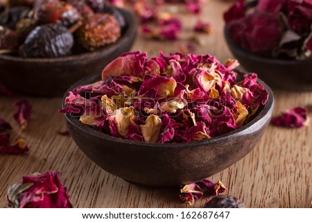Dried rose petals: for tea, alternative medicine, pot-pourri. Copy space. Royalty-Free Stock Photo #162687647