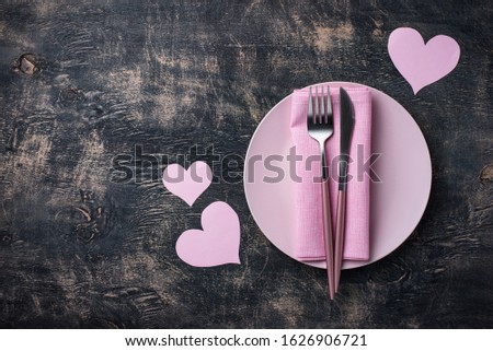 Valentines Day table setting in pink color on black background