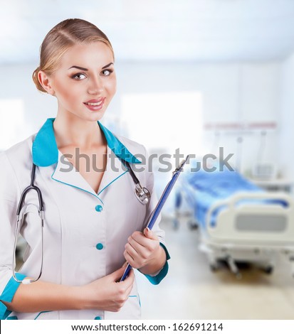 Young medical doctor woman in the office with stethoscope and clipboard