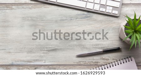 White desk office with laptop, smartphone and other work supplies with cup of coffee. Top view with copy space for input the text. Designer workspace on desk table essential elements on flat lay