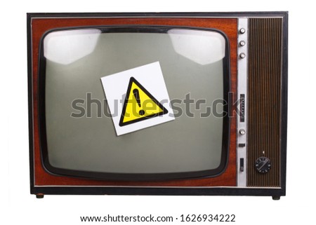 Vintage retro black and white TV with yellow attention sign isolated on white background