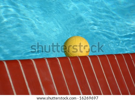 Plastic toy ball in a beautiful swimming pool
