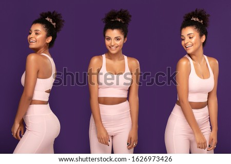 Fit beautiful afro american woman posing in sporty clothes in studio. Smiling girl exercising. Healthy lifestyle concept.