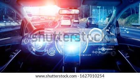 Interior of autonomous car. Driverless vehicle. Self driving. UGV. Advanced driver assistant system. Royalty-Free Stock Photo #1627010254