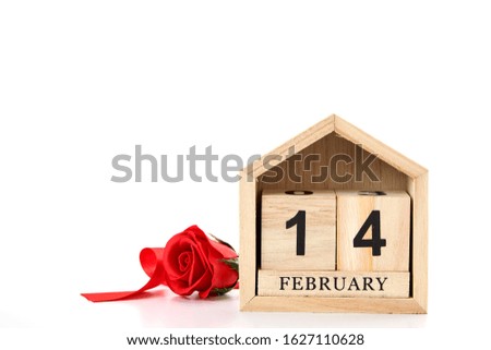 Red roses and red ribbons, red hearts decoration with February 14 Calendar to Happy Valentines day on white background, copy space for text