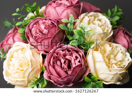 Flowers in bloom: A large bouquet of pink and white peonies.
