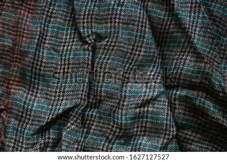 Checkered fabric. Rumpled fabric texture. Selective focus. 