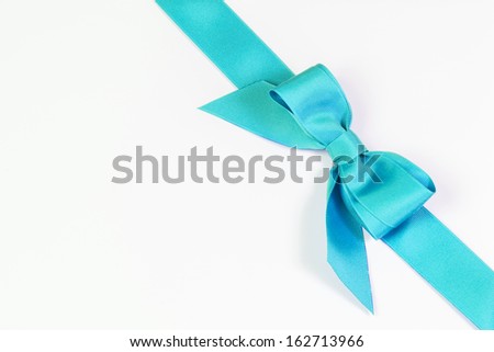 Aqua blue ribbon and bow isolated on white
