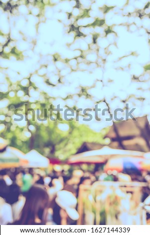 Vintage tone abstract blurred image Local day market in garden with bokeh  for background usage.