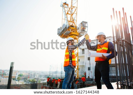 Engineers oversaw the construction site skyscraper. Royalty-Free Stock Photo #1627144348