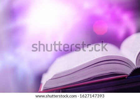 The Book magic lighting with the bright shining down background. Imagine a picture book concept.
knowledge concept learning technology. Education kids books. Book open with a sparkling golden.
