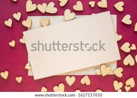 Minimalistic card mockup with wooden hearts. minimalistic invitation
