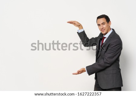 Problems work man in a classic suit red tie gesticulating with his hands