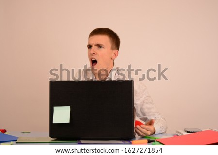 man sitting at a computer in the office business manager