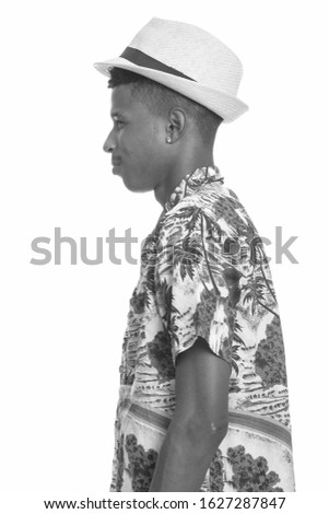 Profile view of young handsome African man ready for vacation
