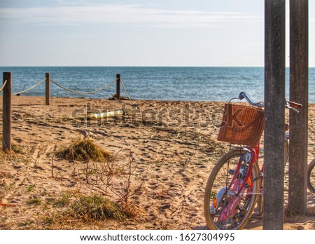 beach landscape photography on a sunny day with parked bicycle