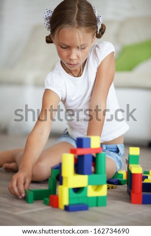 Child playing with blocks at home