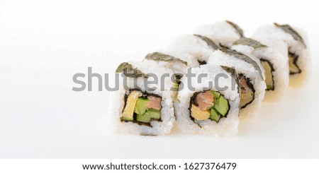 Set of Sushi rolls with cream cheese and salmon inside isolated on white background. Japanese cuisine concept. California, philadelphia sushi rolls. Banner with copy space.