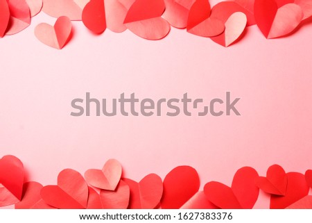 Cut out of red paper hearts on pink background. Good Valentines day, Womans day, love, romantic or wedding composition with free space for custom text for banner, congratulation, card, offer, flyer