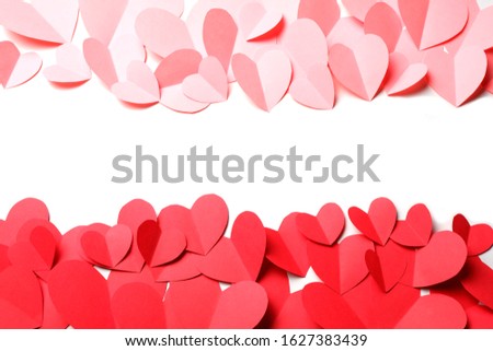 Cut out of red and pink paper hearts on red background isolated. Beautiful Valentines day, Womans day, love, romantic or wedding composition with empty space for custom text for banner, congratulation