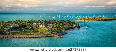 Panoramic sunrise landscape view of the small Islands Sunset Key and Wisteria Island of the Island of Key West, Florida Keys. Royalty-Free Stock Photo #1627392397