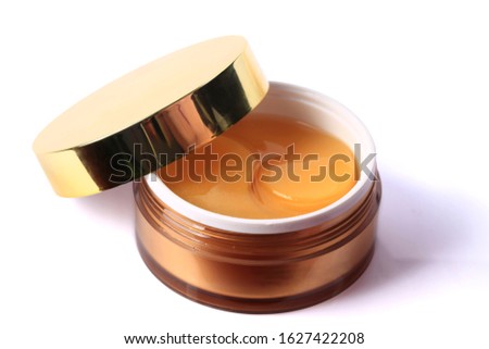 Transparent patches under in round jar a concept of moisturizing and skin care isolated on white background