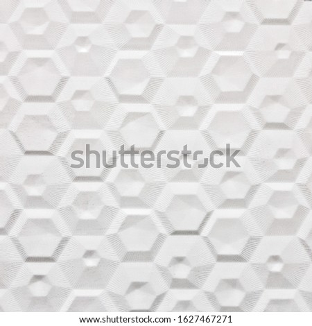 White ceramic tile with geometric pattern for wall and floor decor. Concrete stone surface background. Texture for interior design project.