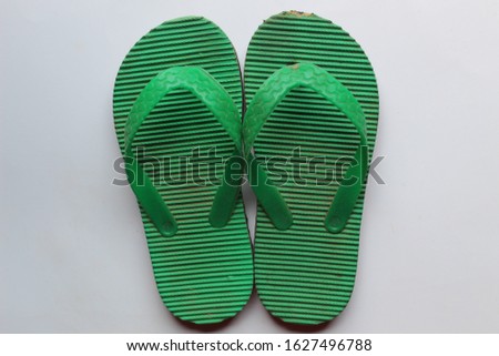 stock photos of a pair of green flip flops