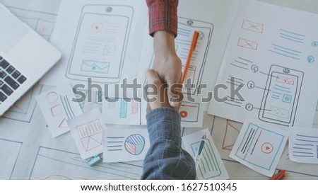 Designers man drawing (UX) (UI) Graphic designer creative sketch planning application process development prototype for application on smartphone