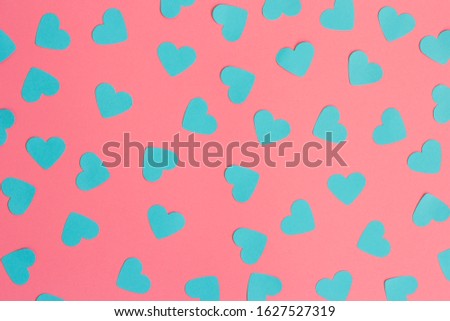 Valentines composition , blue hearts on pink background
