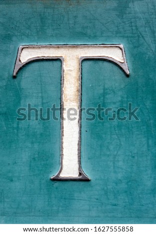 Written Wording in Distressed State Typography Found Letter T