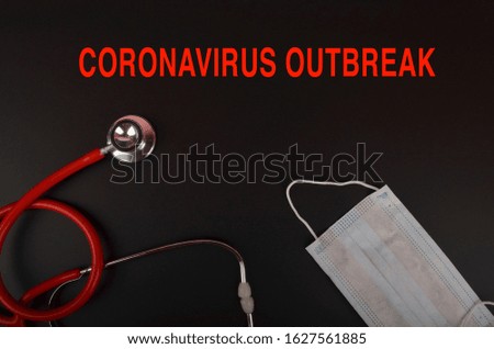 Novel coronavirus - 2019-nCoV, WUHAN virus concept. CORONAVIRUS text on dark background with stethoscope, world globe, surgical mask protection and oxygen face mask. Selective focus.