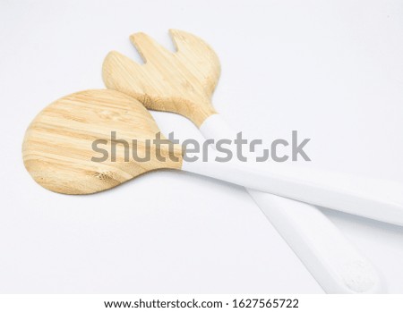 wooden spoon and fork for salad isolated on white background. healthy  eating concept. fresh. go green