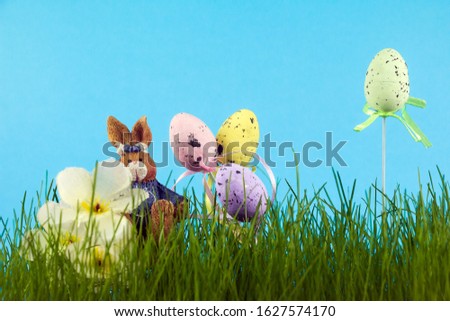 Happy Easter! Composition for Easter greeting on a blue background. Place for text.