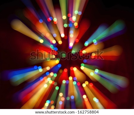 abstract background bokeh of colored light bulbs in motion