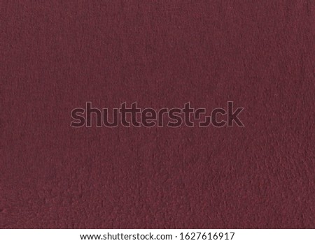 texture of maroon fabric in spools