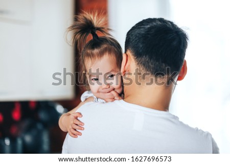 happy father and daughter and father's day. Dad hugging small baby daughter.