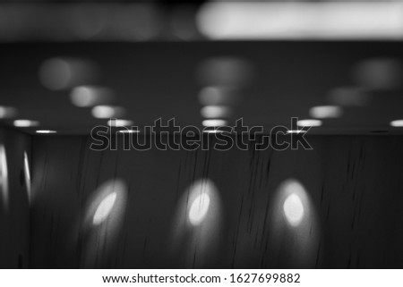 Abstract Geometric Background of Light Shining Through Wooden Holes