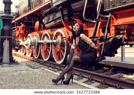 Young girl at the retro train station