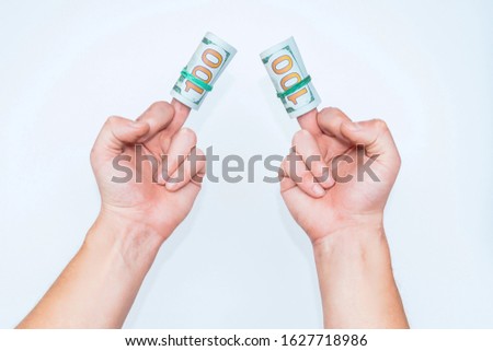 Two hands and dollars isolated on white backgrounds