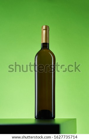 Wine bottle on artistic paper background