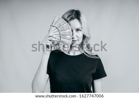 Woman showing  money real dollars on white background